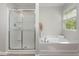 Bright bathroom featuring a walk-in shower, soaking tub, and large window at 3047 Kilarney Ridge Loop, Cary, NC 27511
