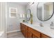Bathroom boasting double vanities, quartz counters, and decorative mirrors at 3047 Kilarney Ridge Loop, Cary, NC 27511