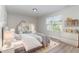 Charming bedroom is decorated with shelving, toys, and a plush bed set at 3047 Kilarney Ridge Loop, Cary, NC 27511