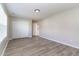 Bright bedroom features wood-look flooring, double closet, and fresh, neutral paint at 3047 Kilarney Ridge Loop, Cary, NC 27511