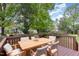 Back deck features outdoor table and chairs with a tranquil, private space at 3047 Kilarney Ridge Loop, Cary, NC 27511