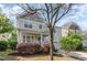 Charming two-story home featuring a welcoming porch, landscaped yard and attached garage at 3047 Kilarney Ridge Loop, Cary, NC 27511