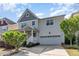 Charming two-story home featuring a welcoming porch, landscaped yard and attached garage at 3047 Kilarney Ridge Loop, Cary, NC 27511