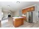 This is the kitchen, and the living room. It is an open concept with stainless steel refrigerator at 3047 Kilarney Ridge Loop, Cary, NC 27511