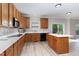 Well-equipped kitchen boasts ample countertop space, an island, and modern appliances at 3047 Kilarney Ridge Loop, Cary, NC 27511