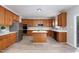 Charming kitchen equipped with an island, stainless steel appliances, and lots of counter space at 3047 Kilarney Ridge Loop, Cary, NC 27511