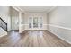 Spacious living room with sleek floors, abundant natural light, and open floor plan, perfect for entertaining at 3047 Kilarney Ridge Loop, Cary, NC 27511