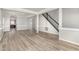 Spacious living room features hardwood floors and a staircase leading to the upper level at 3047 Kilarney Ridge Loop, Cary, NC 27511