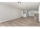 Open living room with recessed lighting, neutral paint, and wood-look floors at 3047 Kilarney Ridge Loop, Cary, NC 27511