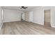 Large main bedroom boasts neutral paint, wood-look floors, ceiling fan and ensuite bath at 3047 Kilarney Ridge Loop, Cary, NC 27511