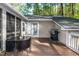Enjoy outdoor dining on this back deck with a grill and natural wooded views at 3217 Brennan Dr, Raleigh, NC 27613