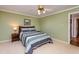 Comfortable bedroom with plush carpeting, natural light, and charming decor at 3217 Brennan Dr, Raleigh, NC 27613