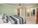 Bright bedroom with a ceiling fan, closet access, and ensuite bathroom access at 3217 Brennan Dr, Raleigh, NC 27613