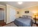 Serene bedroom with a bright yellow walls, plush carpeting, and classic decor at 3217 Brennan Dr, Raleigh, NC 27613