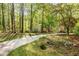This property features a long driveway and wooded surroundings at 3217 Brennan Dr, Raleigh, NC 27613