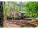 This home is nestled in a wooded lot, providing privacy and shade at 3217 Brennan Dr, Raleigh, NC 27613