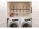 Convenient laundry area with modern washer and dryer units, plus ample storage at 3217 Brennan Dr, Raleigh, NC 27613