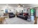 Open-concept living area with hardwood floors, comfortable seating, and ample natural light creates an inviting atmosphere at 3217 Brennan Dr, Raleigh, NC 27613