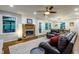 Inviting living room with brick fireplace, hardwood floors, and large windows, creating a warm and welcoming space at 3217 Brennan Dr, Raleigh, NC 27613