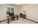 Functional office space with a modern desk, chair, and neutral decor at 3217 Brennan Dr, Raleigh, NC 27613