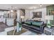 Open concept living room with a kitchen, dining room, and sofa seating at 357 Fosterton Cottage Way, Raleigh, NC 27603