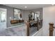 View of the loft featuring neutral paint, gray carpet, decor shelves, and an exercise machine at 357 Fosterton Cottage Way, Raleigh, NC 27603