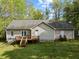 Spacious backyard featuring a wooden deck with direct access to the house at 359 Punch Hill Farm Rd, Rougemont, NC 27572