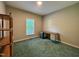 This bedroom has an oversized window, a desk, and shelving, making it a perfect home office at 359 Punch Hill Farm Rd, Rougemont, NC 27572
