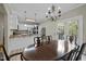 Dining room with french doors that lead to the deck and an open view to the kitchen at 359 Punch Hill Farm Rd, Rougemont, NC 27572