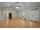 Open living area with wood floors, a ceiling fan, and a light-filled atmosphere at 359 Punch Hill Farm Rd, Rougemont, NC 27572