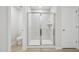 Modern bathroom featuring a glass enclosed tiled shower and a toilet at 3841 Rosebush Dr, Zebulon, NC 27597