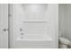 Bathroom featuring a bright-white shower and bath-tub with tiled walls at 3841 Rosebush Dr, Zebulon, NC 27597