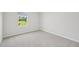 Bright bedroom featuring a window that looks out onto a green lawn at 3841 Rosebush Dr, Zebulon, NC 27597
