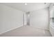 A bedroom featuring neutral carpet, a ceiling light and white trim at 3841 Rosebush Dr, Zebulon, NC 27597