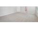 Neutral carpeted bedroom featuring white trim, neutral walls, and attached hallway at 3841 Rosebush Dr, Zebulon, NC 27597