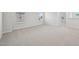 Second floor hallway featuring carpet, neutral paint, multiple windows, and white trim at 3841 Rosebush Dr, Zebulon, NC 27597