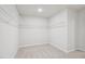 A walk-in closet with neutral carpet and white-coated wire shelving at 3841 Rosebush Dr, Zebulon, NC 27597
