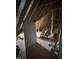Unfinished attic area with exposed beams and insulation offers room to expand or convert into a functional space at 3920 Cedar Knolls Drive Dr # 18, Youngsville, NC 27596