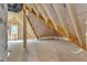 Unfinished attic space showcasing the structural framework and potential for customization in new home at 3920 Cedar Knolls Drive Dr # 18, Youngsville, NC 27596