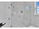 All glass shower enclosure features white tile surround and a built-in seat at 3920 Cedar Knolls Drive Dr # 18, Youngsville, NC 27596