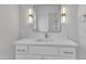 Bathroom with framed mirror and modern lighting above a white vanity sink at 3920 Cedar Knolls Drive Dr # 18, Youngsville, NC 27596