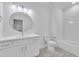 Clean bathroom features a white vanity, round mirror, and subway-tiled shower at 3920 Cedar Knolls Drive Dr # 18, Youngsville, NC 27596