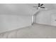 Well-lit attic bedroom with ceiling fan and natural light from a small window at 3920 Cedar Knolls Drive Dr # 18, Youngsville, NC 27596