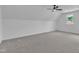 Attic bedroom has a modern ceiling fan and natural light from a small window at 3920 Cedar Knolls Drive Dr # 18, Youngsville, NC 27596