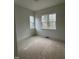 Bedroom offering two windows that provide lots of natural light, new trim, and neutral wall paint at 3920 Cedar Knolls Drive Dr # 18, Youngsville, NC 27596