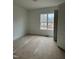 Bedroom with a large window providing abundant natural light and outdoor scenery at 3920 Cedar Knolls Drive Dr # 18, Youngsville, NC 27596