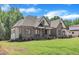 Front yard view of a traditional brick home with manicured lawn and detailed architectural features at 3920 Cedar Knolls Drive Dr # 18, Youngsville, NC 27596