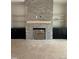 Living room featuring a fireplace with brick surround and floating shelves at 3920 Cedar Knolls Drive Dr # 18, Youngsville, NC 27596