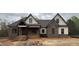 Charming new construction featuring brick, vertical siding, and a welcoming front porch at 3920 Cedar Knolls Drive Dr # 18, Youngsville, NC 27596