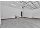 Spacious three car garage with gray concrete flooring and white walls, offering ample parking at 3920 Cedar Knolls Drive Dr # 18, Youngsville, NC 27596